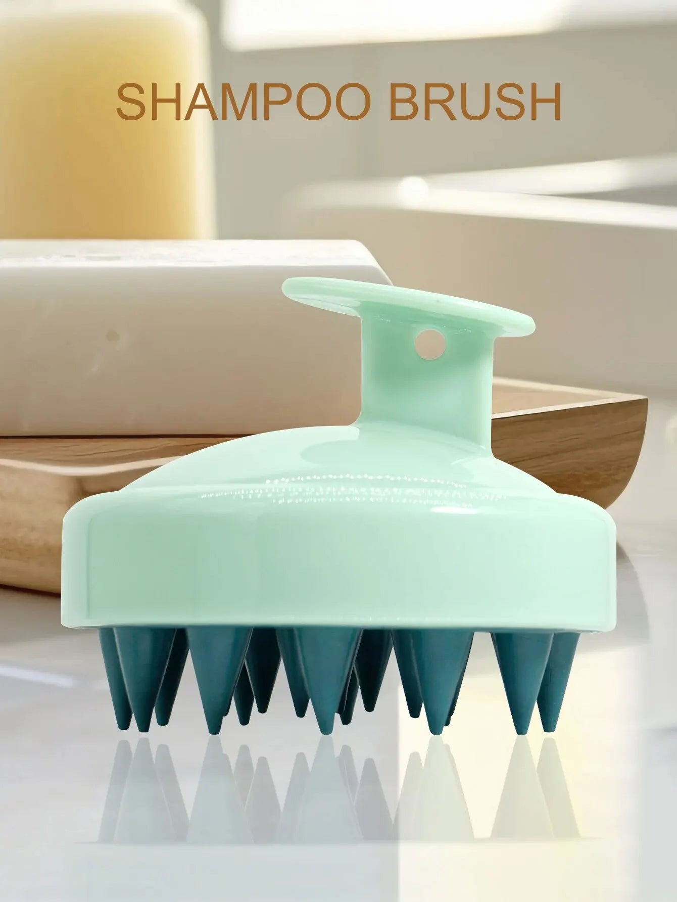 Green shampoo brush on a reflective surface with a blurred background